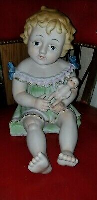 LARGE VINTAGE GERMAN BISQUE PIANO BABY HOLDING BABY DOLL figurine 12” approx