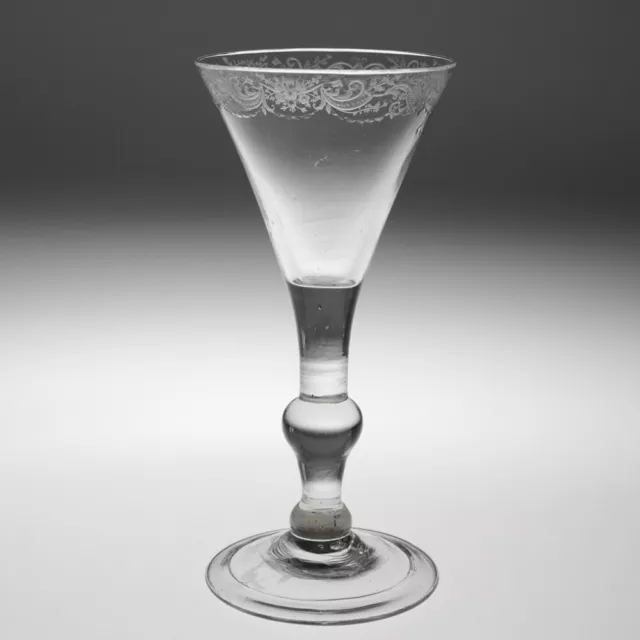 An Early Rococo Engraved Balustroid Wine Glass c1730-40