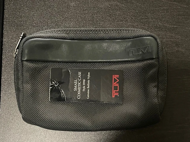 NWOT attached TUMI ZIP COSMETIC CASE  WITH loose tag brand new never used