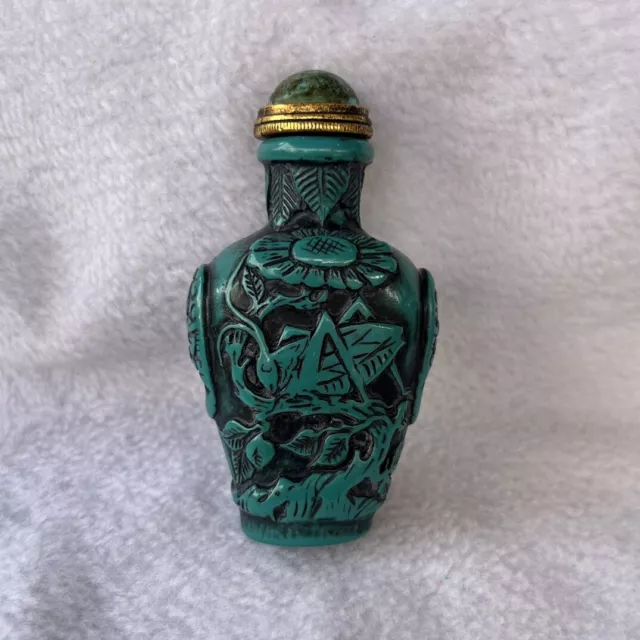 A fine turquoise carved cricket snuff bottle from a Chinese collection