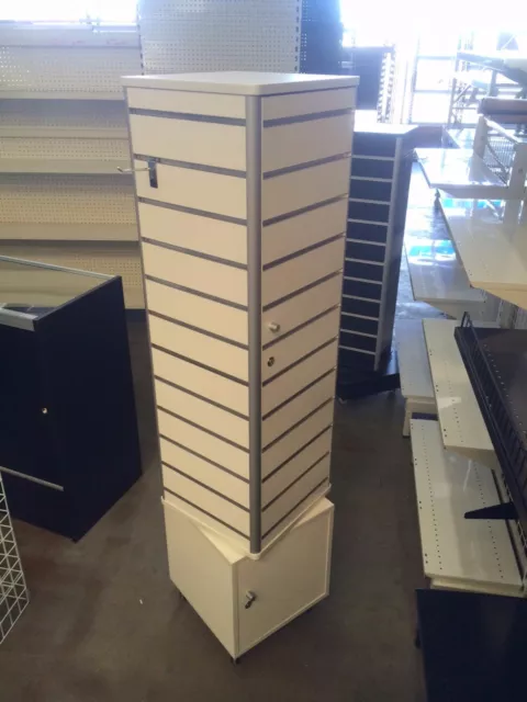 White spinning slatwall tower with storage inside shop fittings Available Now