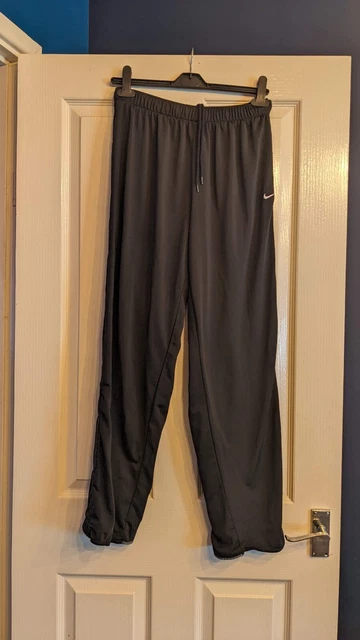 Nike tracksuit with ticks down best sale the side