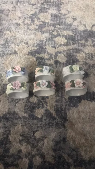 Six flowered ceramic napkin holders