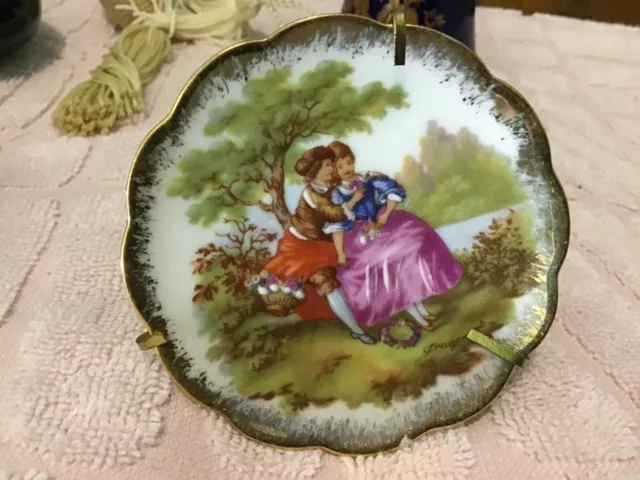 Decorative limoges miniature plate of Fragonas courting couple