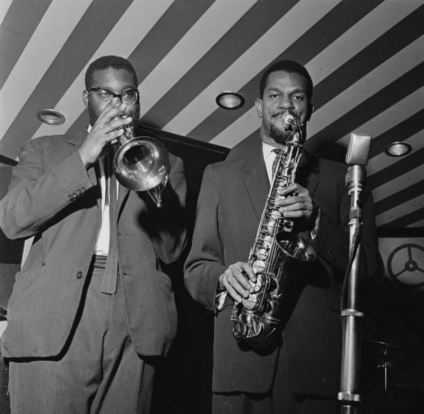 JAMAICAN JAZZ SAXOPHONE player Joe Harriott pictured on right 1960s