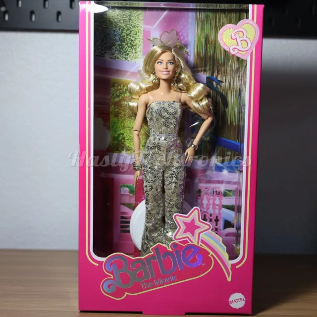 Mattel - Barbie The Movie: Barbie Doll in Gold Disco Jumpsuit (HPJ99)