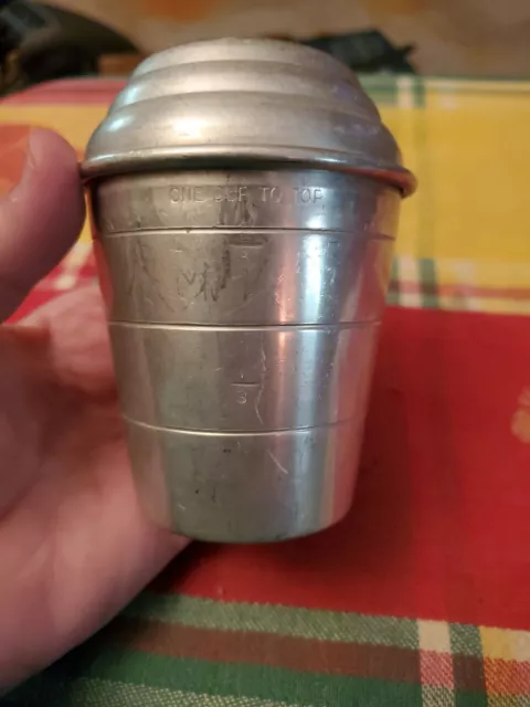 https://www.picclickimg.com/jA0AAOSwAJZlOT5G/MIRRO-Aluminum-Measuring-Cup-Shaker-With-Lid-1.webp