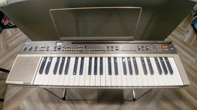Yamaha PC-1000 Electronic Keyboard with manuals, playcards, case, and stand