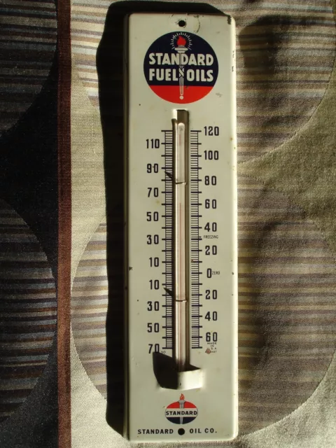 https://www.picclickimg.com/jFIAAOSwOFtla6H8/Vintage-Standard-Fuel-Oils-Thermometer-With-Torch-Logo.webp