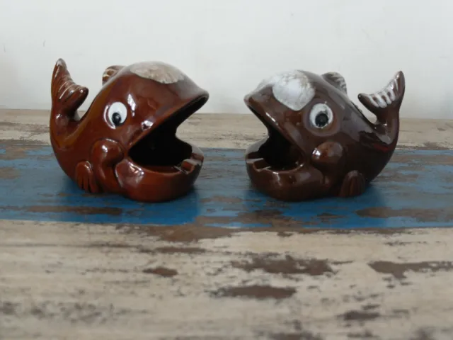 Two 1960s pottery brown glazed whale cigarette holders