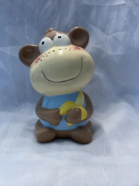 Cute Ceramic monkey With A Banana Piggy bank. Great For A Kids Room. Has Stopper