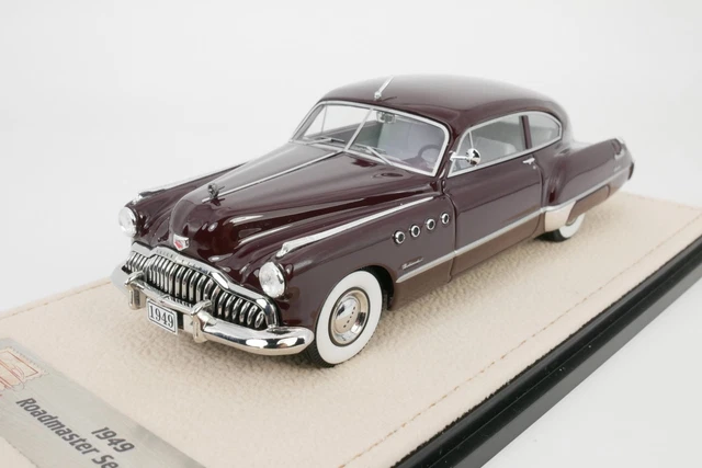 A red and black 1956 Buick Roadmaster Century Riviera four-door hardtop