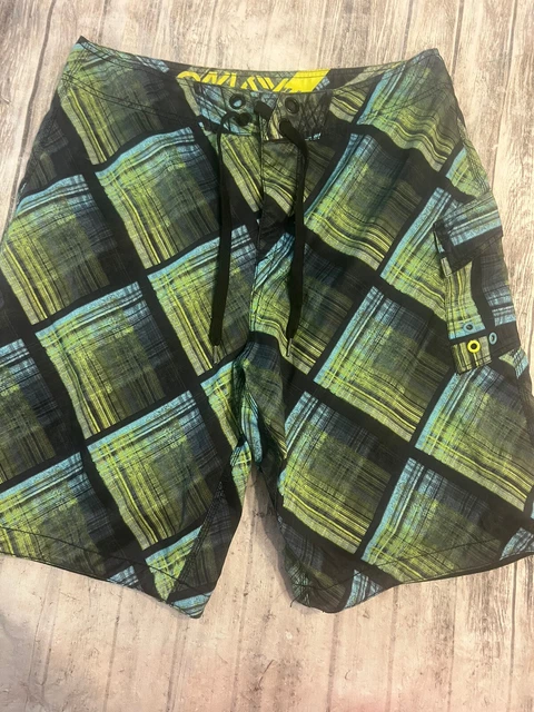Oakley Men's Beach Swim board shorts, size 34 yellow black inseam, 10.5 inches. Oakley Men's Beach Swim board shorts, size 34 yellow black inseam, 10.5 inches.