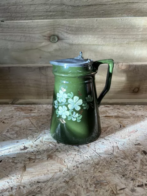 Antique pottery jug /pitcher green glaze hand painted flowers pewter hinged lid.