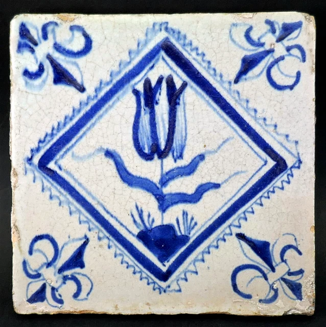 c1640, ANTIQUE 17thC DUTCH DELFT BLUE AND WHITE TILE, TULIP FLEUR DE LIS CORNERS