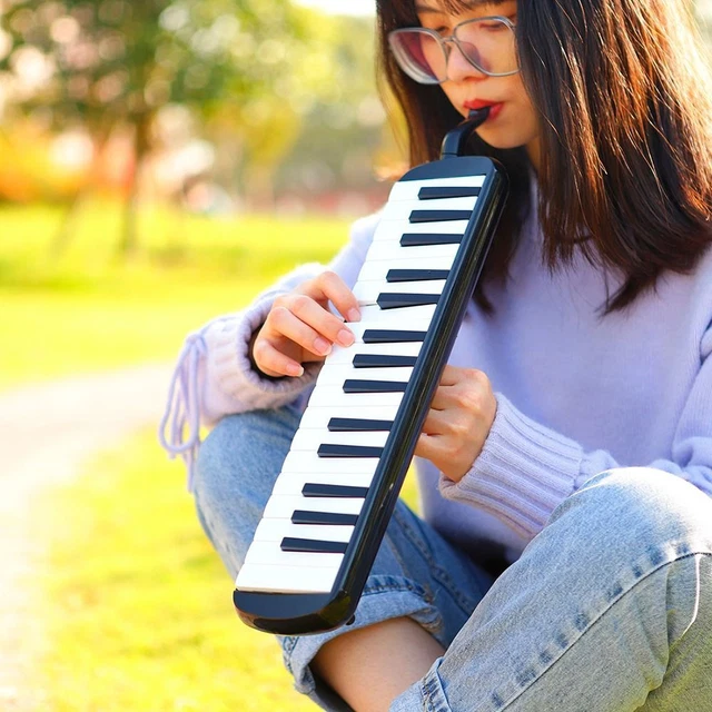 Mini piano you blow into discount