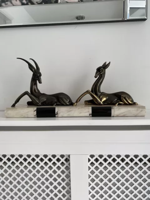 French Art Deco spelter figures of a gazelle and a deer mounted on a marble base