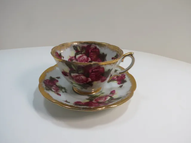 NAPCO BONE CHINA Tea Cup and Saucer Japan Blue Iridescent with Gold W/ Red Roses