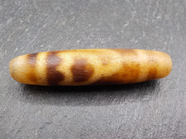An Agate Dzi bead with a Lotus Flower pattern from Tibet / Nepal.