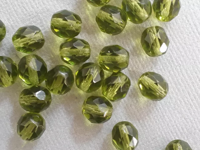 12 Czech fire polished olive green glass beads 8mm. Nice transparent beads!