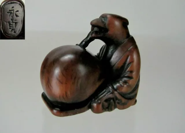 KOMEI, ISHIKAWA, 19th C Japanese Boxwood Netsuke: TANUKI NO HARA TSUZUMI