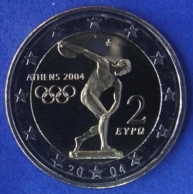 Pièce De 2 Euros Commémorative Jeux Olympiques Athènes 2004 - État TTB, Flan Avec Surplus De Métal