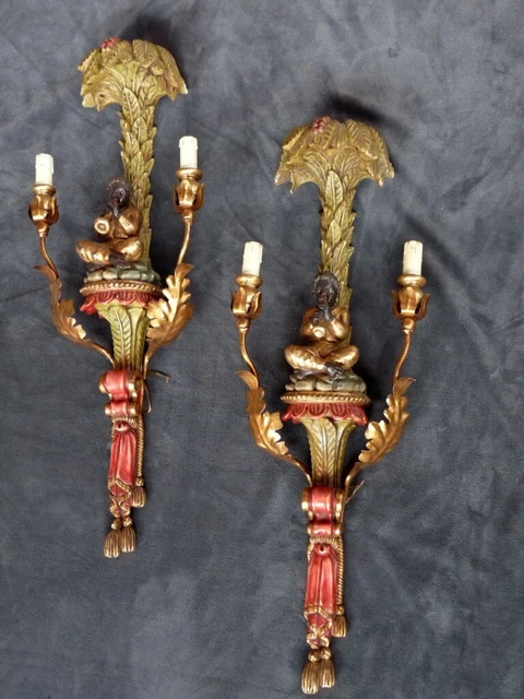 Paire d'appliques en bois polychrome nubien jouant de la flute sous un palmier