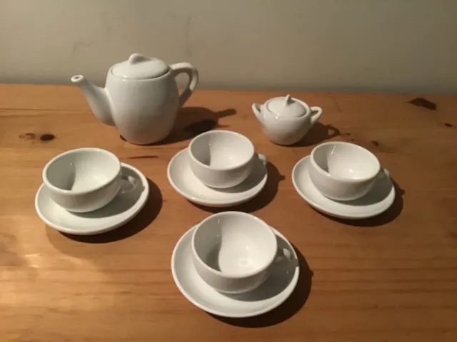 Childs white ceramic tea set. Teapot cups saucers sugar bowl. Toy. VGC