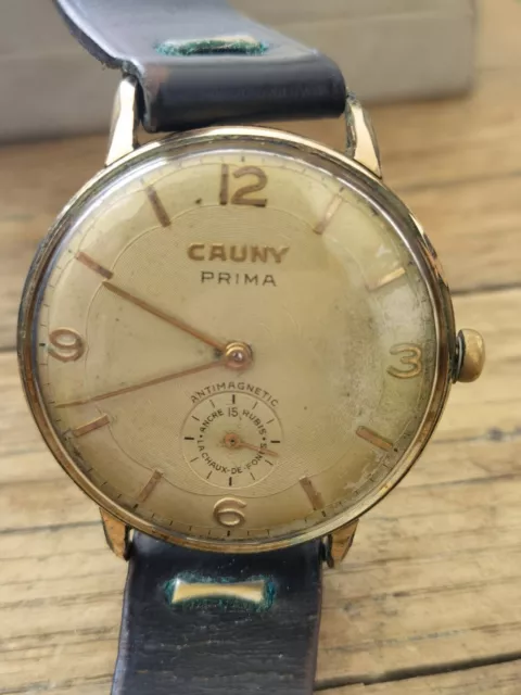 Montre Cauny Prima 37 mm ancre 15 rubis la chaux-de-fonds swiss made fontionne