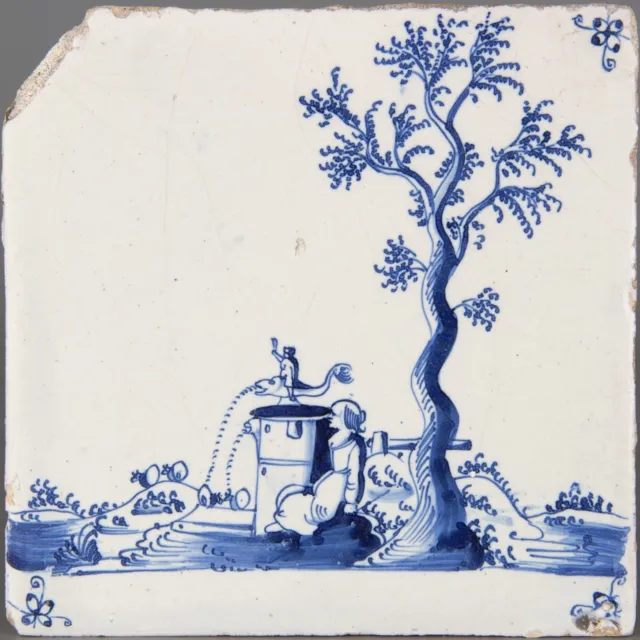 Nice Dutch Delft Blue tile, lady in landscape with fountain, late 17th century.