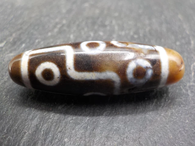 An Agate Dzi bead with a 9 Eye pattern from Tibet / Nepal.