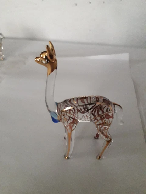 Lot de 4 figurines type biches  en cristal transparent décorées d'or