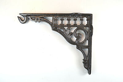 A lovely antique style cast iron wall light hanging bracket hook shelf shelving