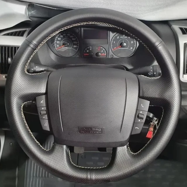 Fiat Ducato interior upgraded with leather and fabric upholstery combination