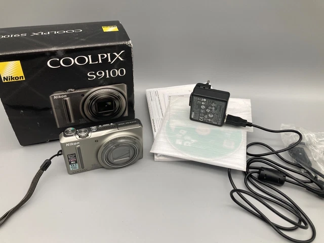 NIKON COOLPIX S9100 12,0mp FOTOCAMERA DIGITALE ARGENTO IN IMBALLO ORIGINALE