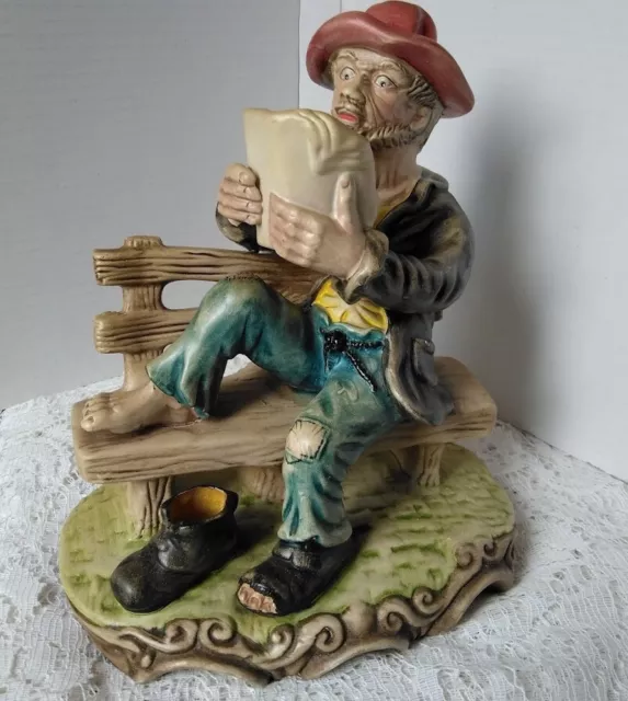 Old Man Tramp Reading on a Bench Figurine in Capodimonte style