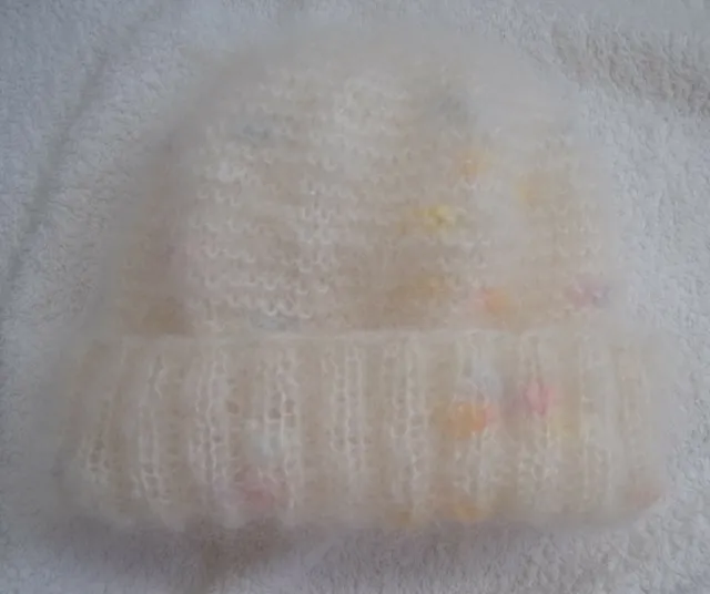 Hand knitted ladies mohair hat in off white/rainbow with a 2 x 2 ribbed band