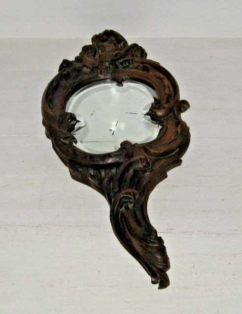 Ancien miroir face à main en bois sculpté glace biseautée
