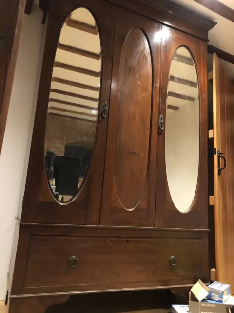 Antique double oval mirror door wardrobe