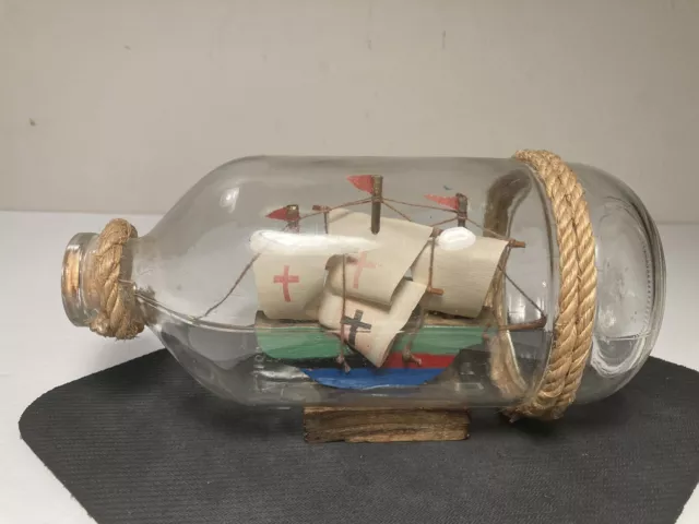 Vintage Ship In a Bottle Three Mast Rope Cork Blue Water Nautical Decor 7.25”