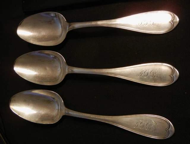 Three James Conning serving coin silver spoons in the Oval Thread pattern
