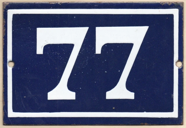 Old blue French house number 77 door gate wall fence street sign plate plaque