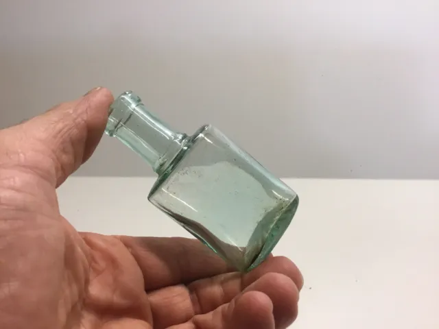 Small Antique Aqua Perfume Bottle. Sun Burst On Bottom.