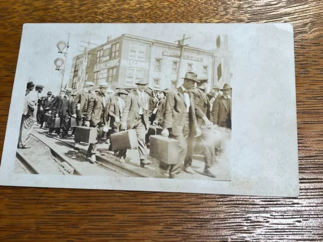 Antique RPPC Getting off the Train Cigar Factory Background 1910 Businessmen