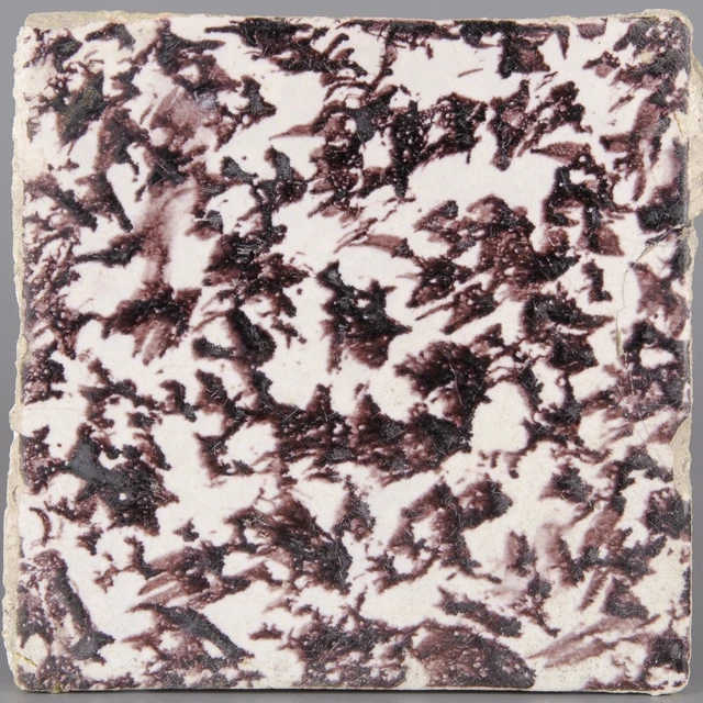 Dutch Delft manganese tile, dotted decoration, 17th century