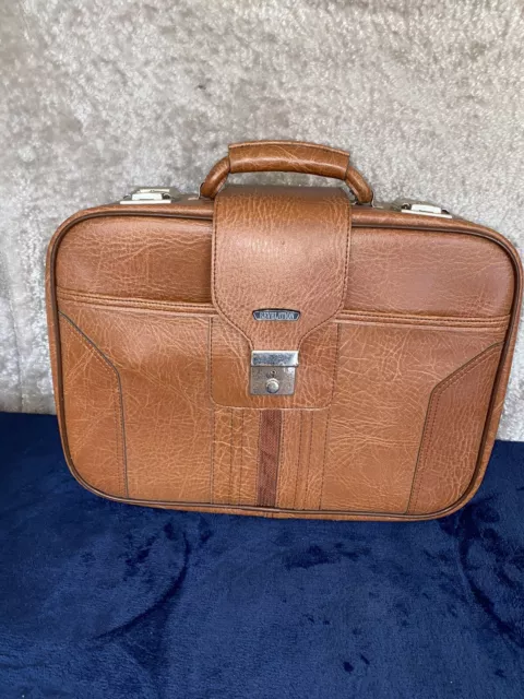 How to clean stains off LV patent leather bag??? Was stained inside a  luggage put together with a 70s magazine and the cover ink rubbed off. It  would not come off after