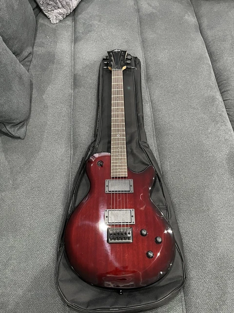LAG AK 100 Corps en Bouleau Guitare Electrique avec Cordes Elixir - Noire