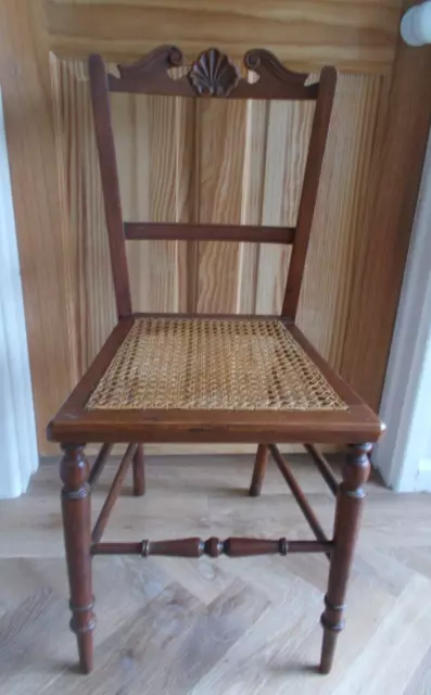 Antique wooden bedroom/ salon/ hall chair with cane seat . Shell/scallop detail