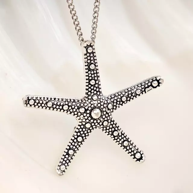 Grand collier pendentif étoile de mer avec bavoir finition argent, chaîne...