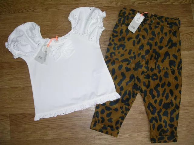 Pantaloni nuovi con etichette River Island stampa con animali bianchi frilly età 18-24 m NUOVI
